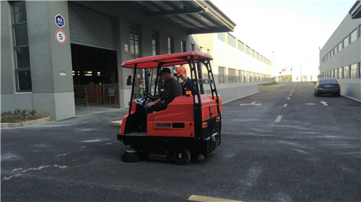 What are the advantages of ride-on sweepers for industrial factories?