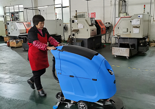 In which industrial industries are hand push floor scrubbers used and their benefits?