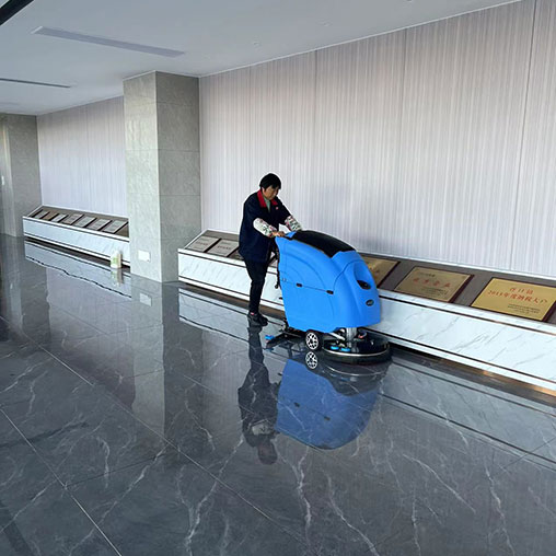 Electric floor scrubber