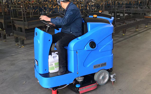 Ride-on floor washing machine